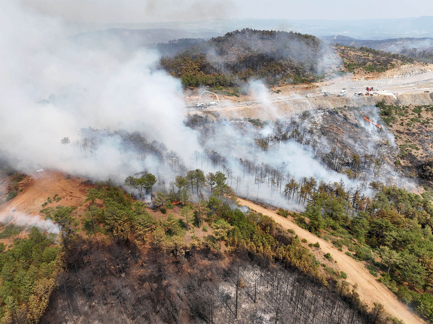 A drone view shows smoke rising from a wildfire burning in Harmancik in the northwestern Bursa province