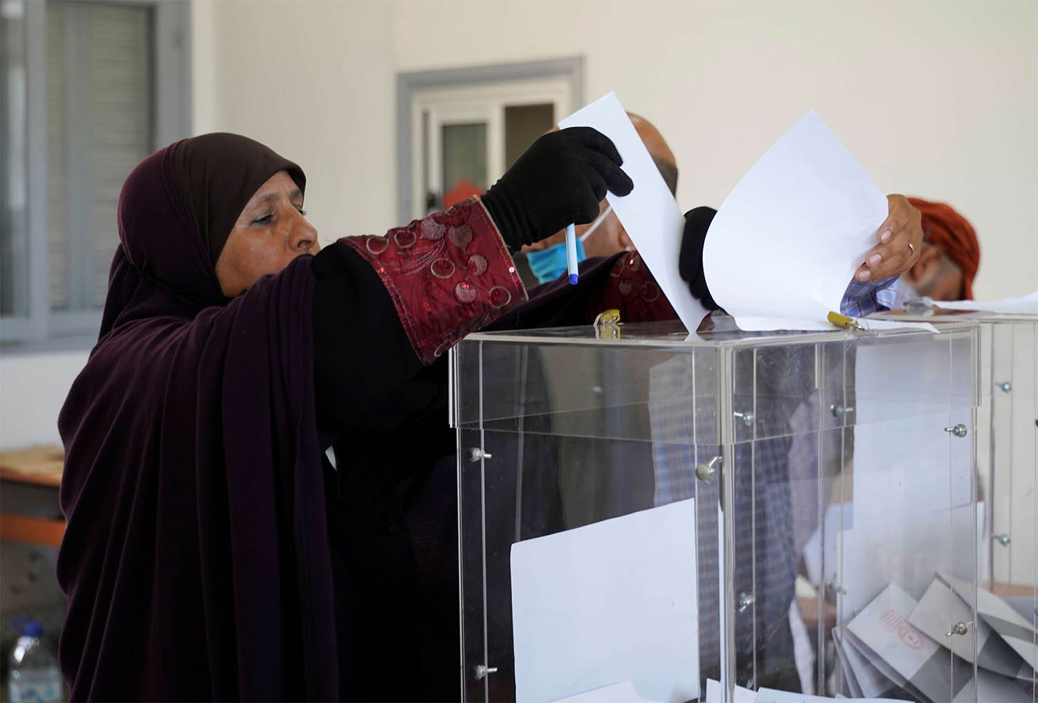 A woman casts her vote at a polling station during parliamentary and local elections, in Casablanca, Morocco September 8, 2021