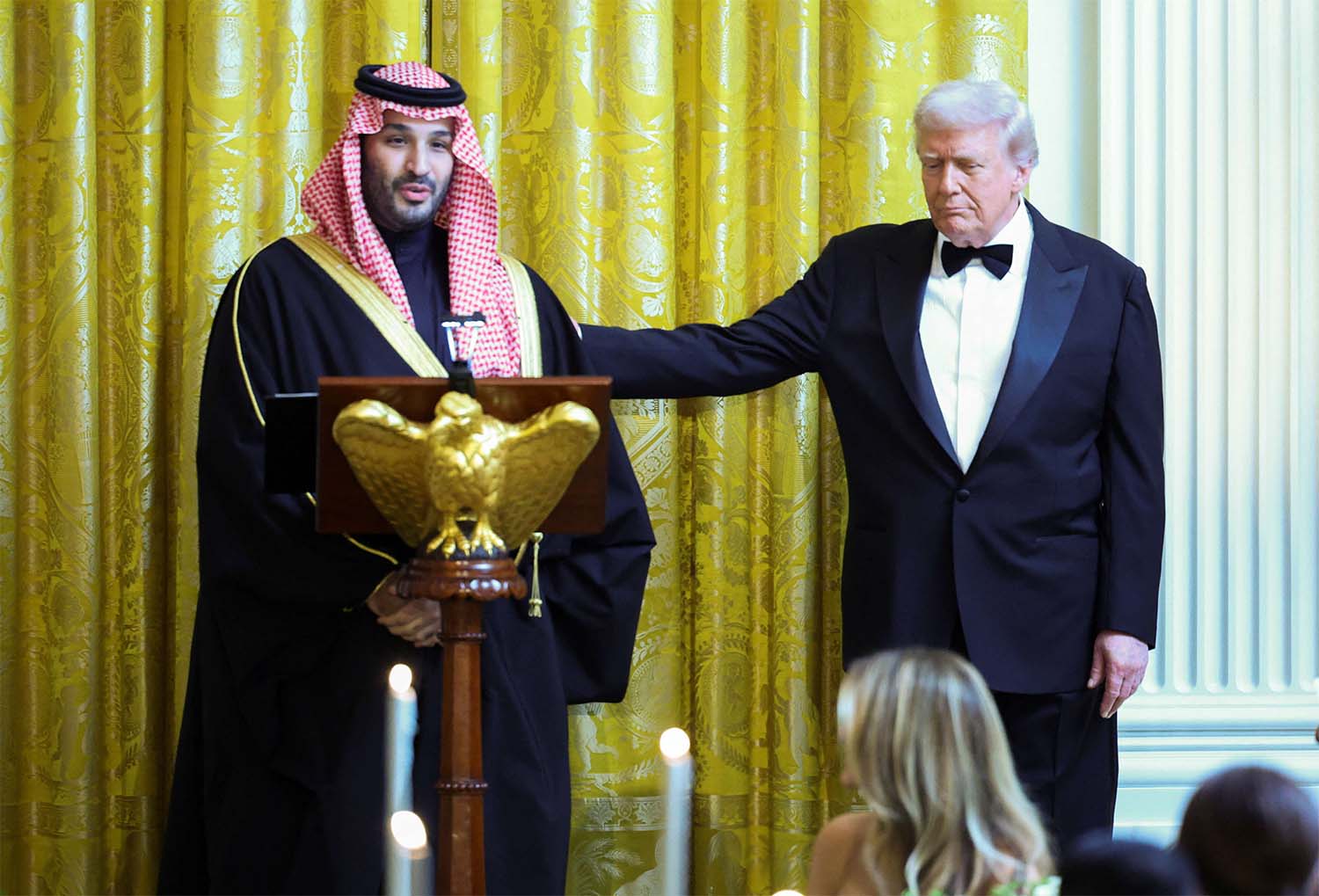 US President Donald Trump greets Saudi Crown Prince Mohammed bin Salman, during a dinner at the White House