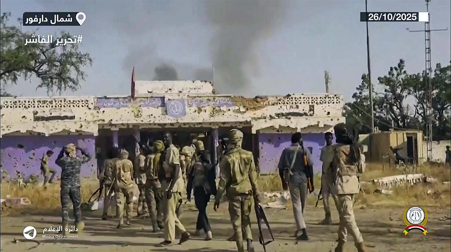 RSF fighters holding weapons and celebrating in the streets of El-Fashir in Sudan's Darfur