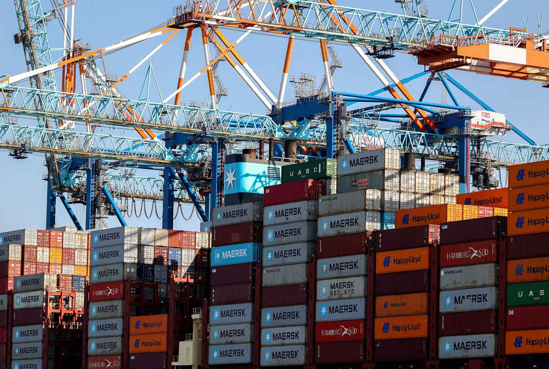 Cranes unload Containers off the Maribo Maersk container ship at a terminal wharf in Bremerhaven, Germany, August 13, 2025. 