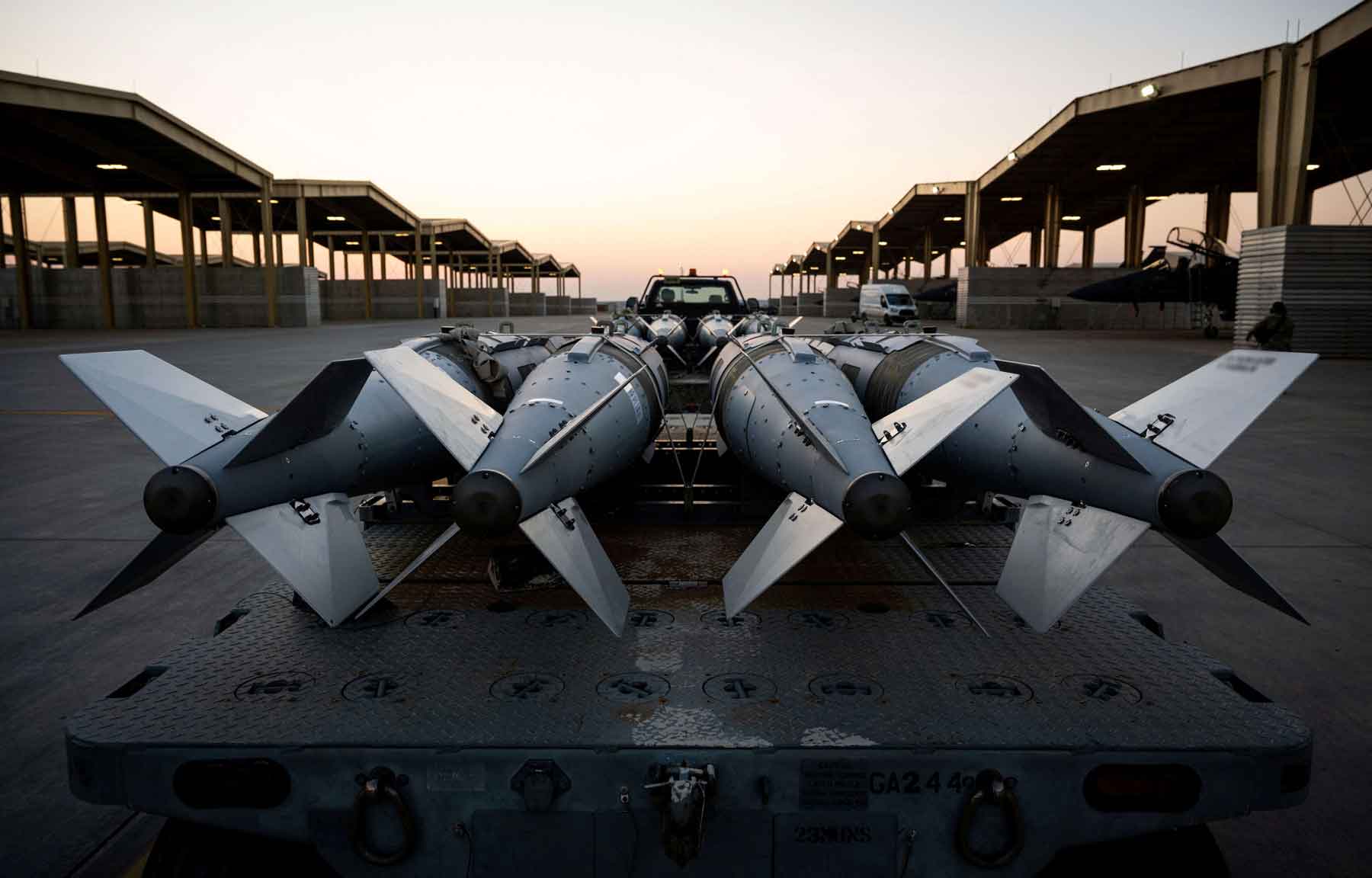 US Airmen prepare to load GBU-31 munition systems onto F-15E Strike Eagles in support of Operation Hawkeye Strike as the US military launched large-scale strikes against dozens of Islamic State targets in Syria, December 19, 2025.