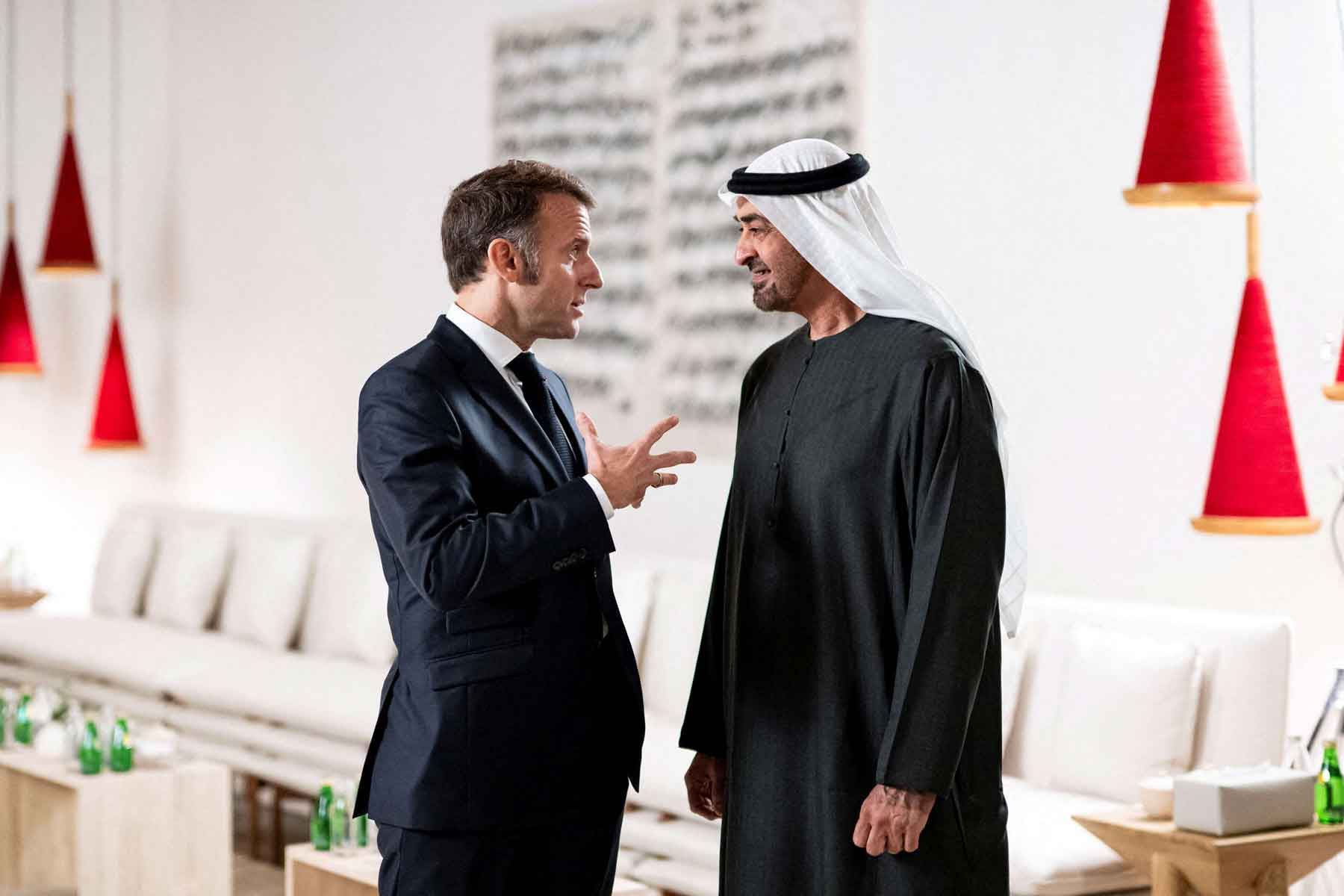 Emirati President Sheikh Mohamed bin Zayed Al Nahyan speaks with French President Emmanuel Macron after a lunch meeting at the Zayed National Museum , Saadiyat Island, Abu Dhabi, December 21, 2025. 
