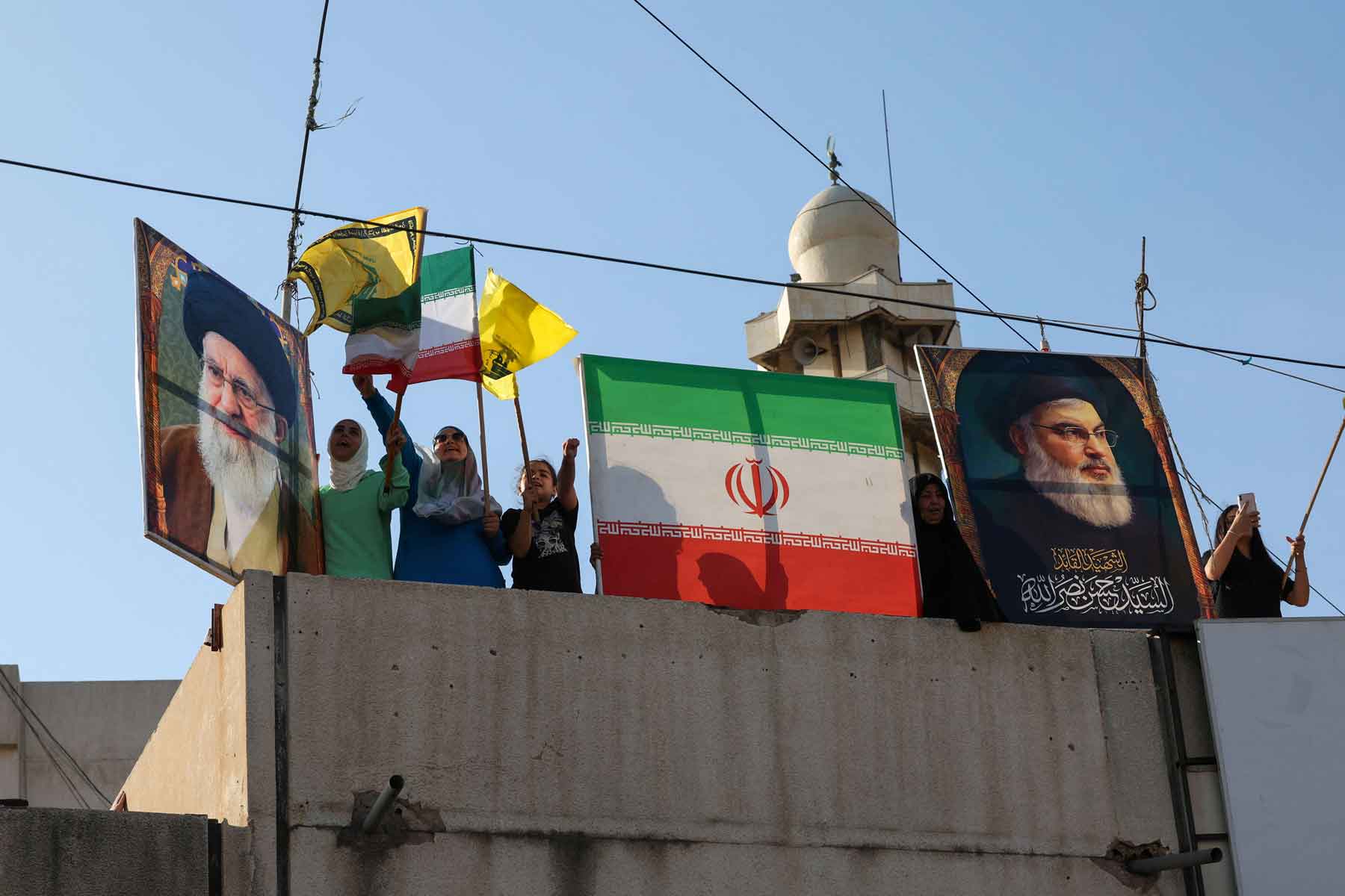 People celebrate what they say is Iran’s victory, after US President Donald Trump announced a ceasefire between Israel and Iran, in Beirut, June 25, 2025. 