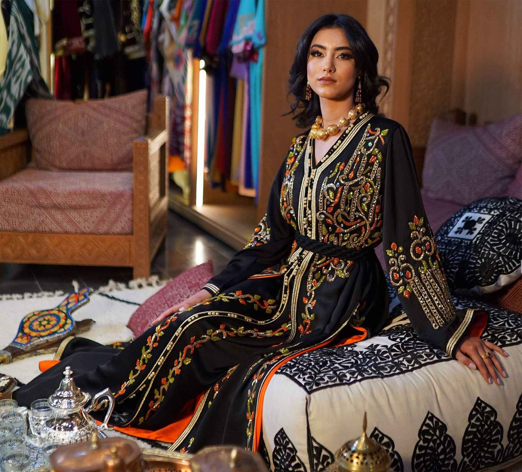 A model wearing the Moroccan caftan poses for a picture. 