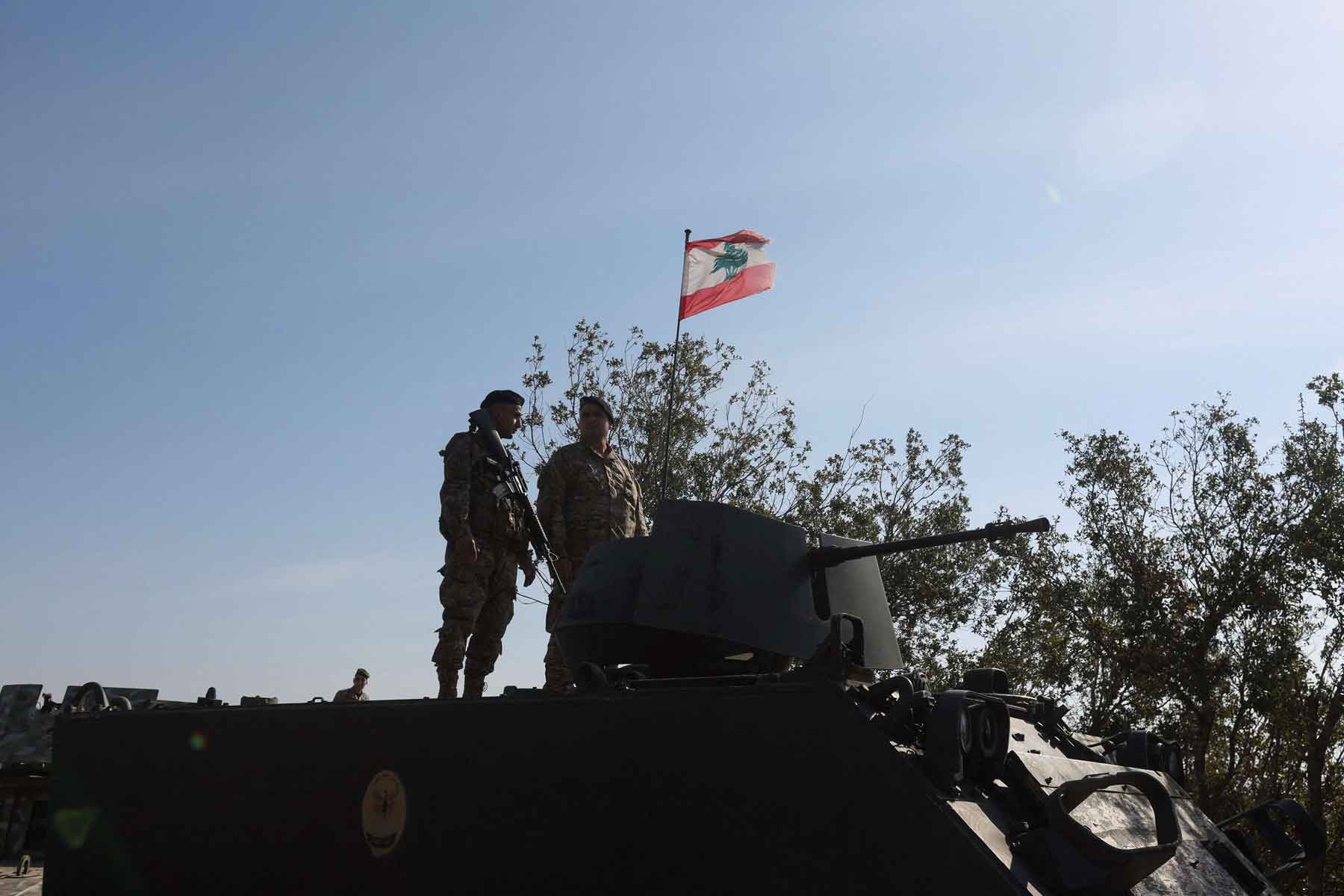 Lebanese army members stand on a military vehicle in Alma Al-Shaab, near the border with Israel, southern Lebanon, November 28, 2025. 