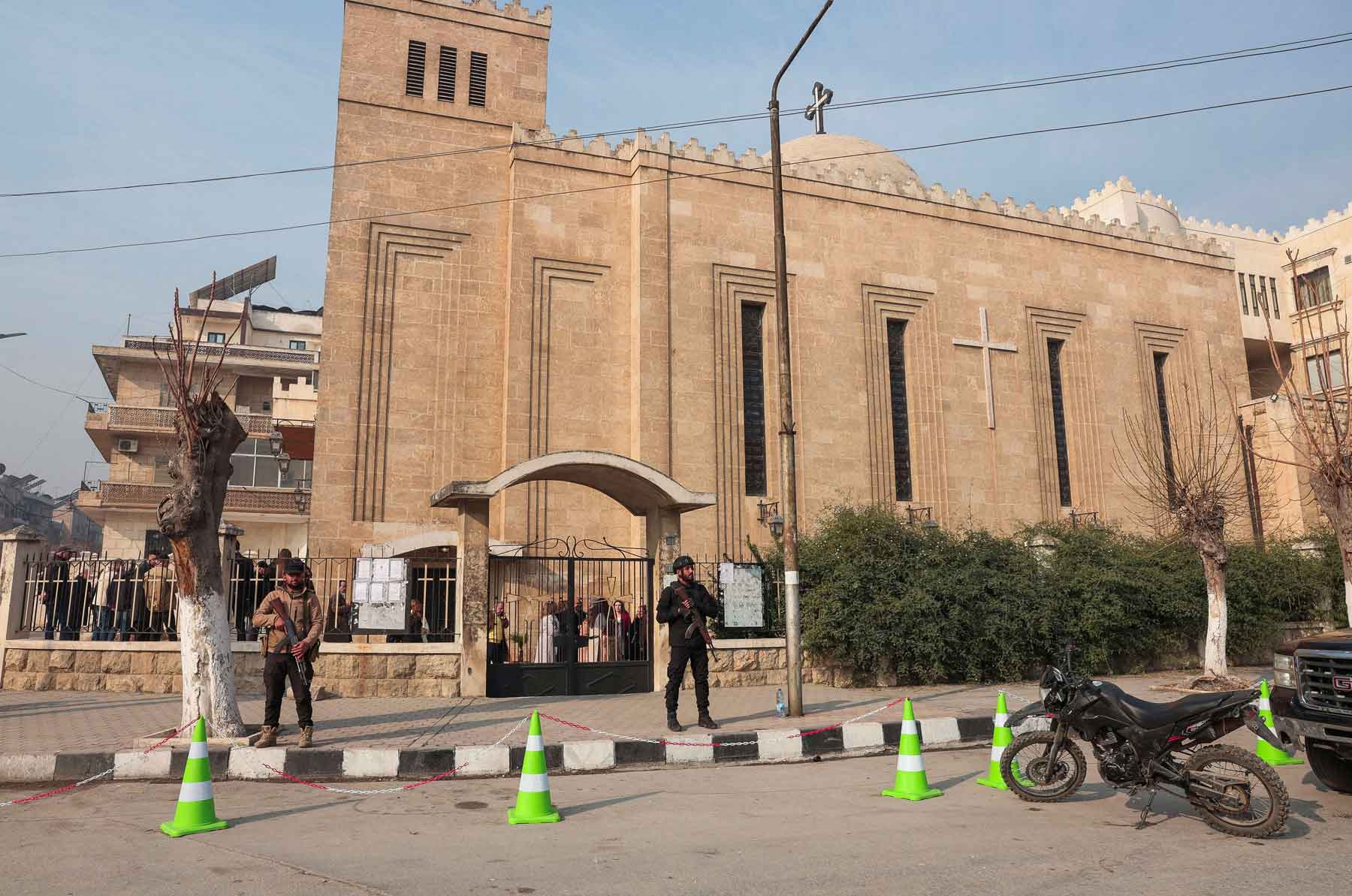 Members of the security forces stand in front of the St. Joseph Chaldean Cathedral on the day Christians attend Christmas Mass celebrations at the Chaldean Catholic Church, in Aleppo, Syria, December 25, 2025. 