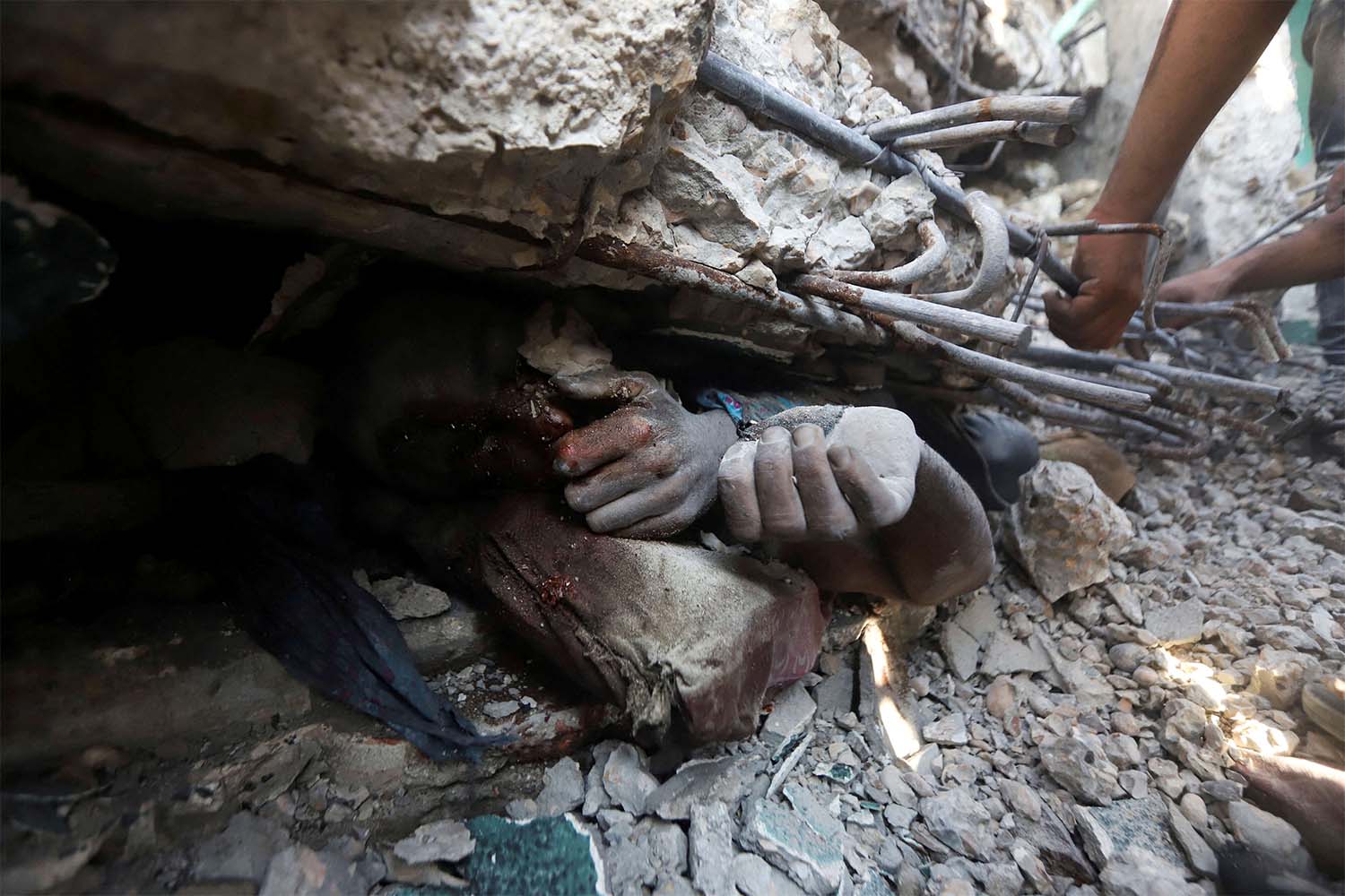 USAID staff reported seeing a human femur and other bones on the roads, dead bodies abandoned in cars