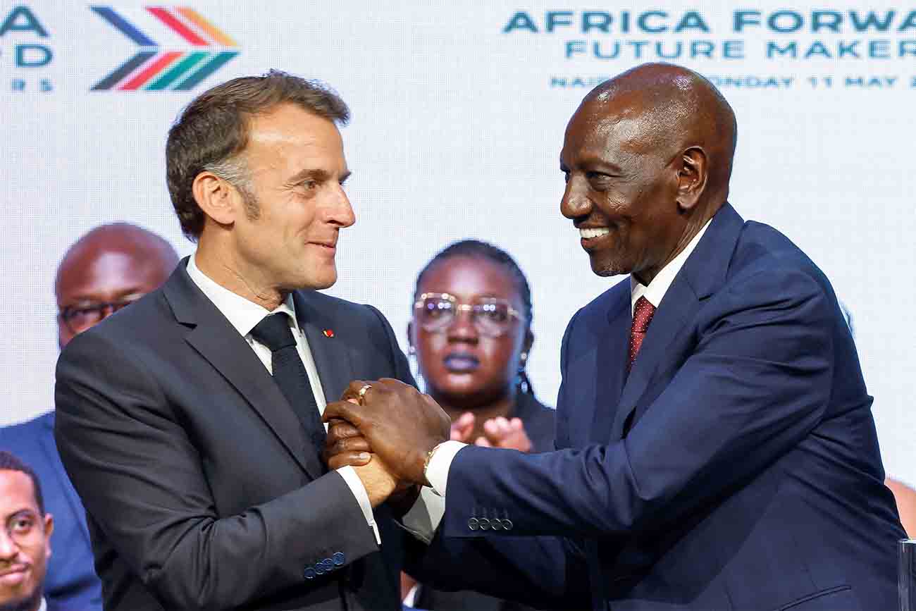 Macron and Kenya's President William Ruto shake hands during the Africa Forward Summit 2026 