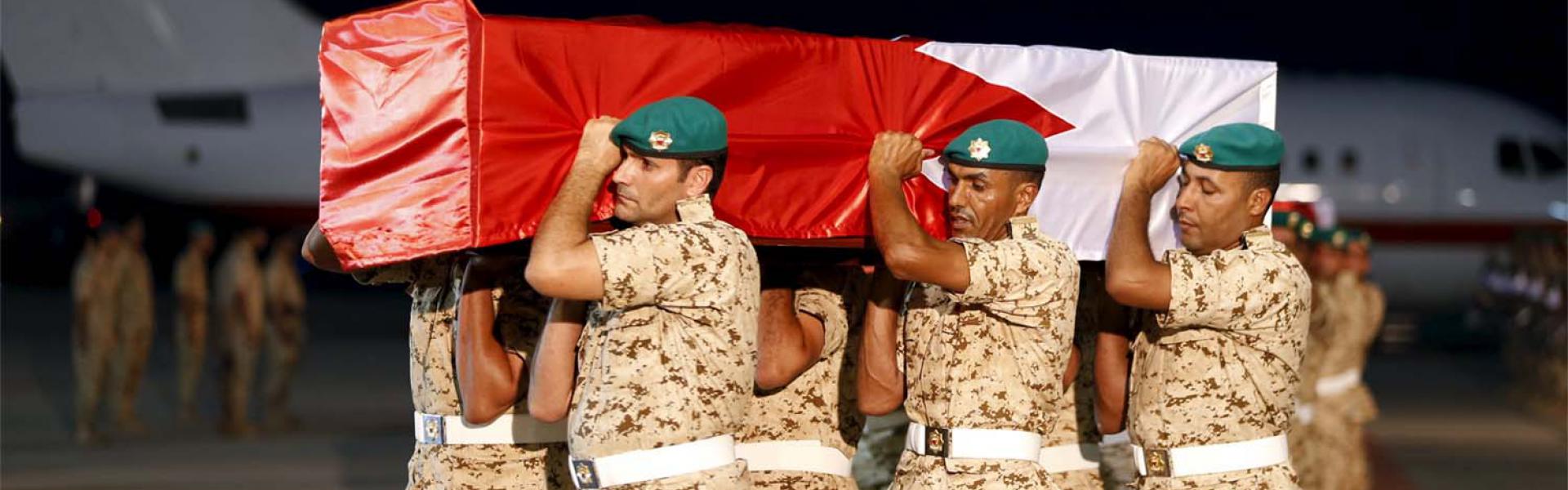 An archive photo of the coffin of a Bahraini soldier is carried by a guard of honour in September 2015
