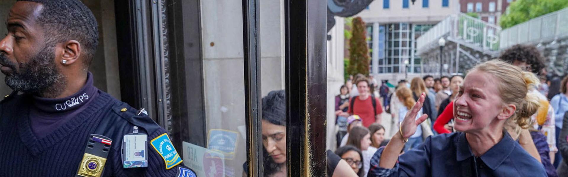 A pro-Palestinian protester yells to let students out of the Butler Library on the campus of Columbia University in New York