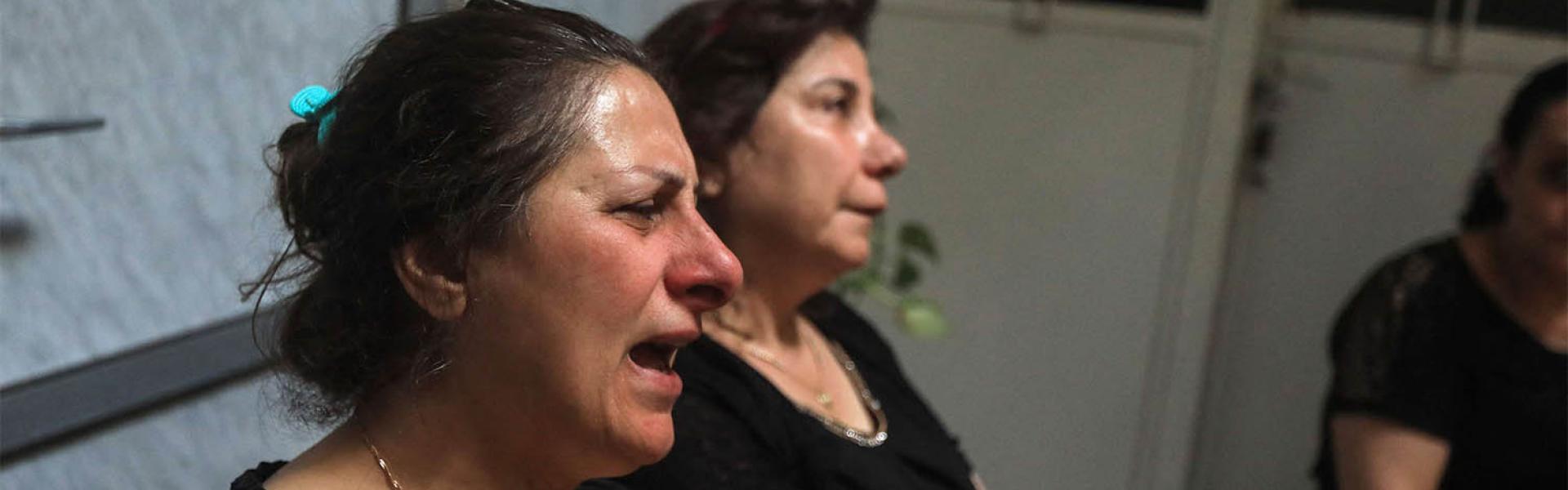  Relatives and friends mourn with members of the Bechara family who lost several members in the suicide attack at the Saint Elias church
