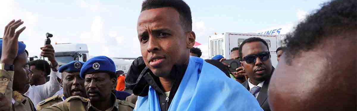 Artan is received as he arrives at the Aden Abdulle Osman International Airport in Mogadishu
