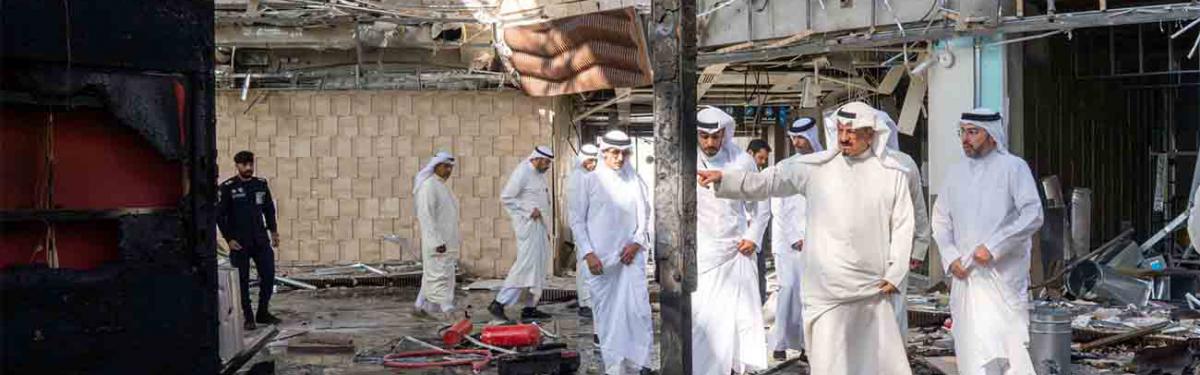 Kuwaiti officials inspect damage inside a terminal at Kuwait International Airport following an Iranian drone and missile attack