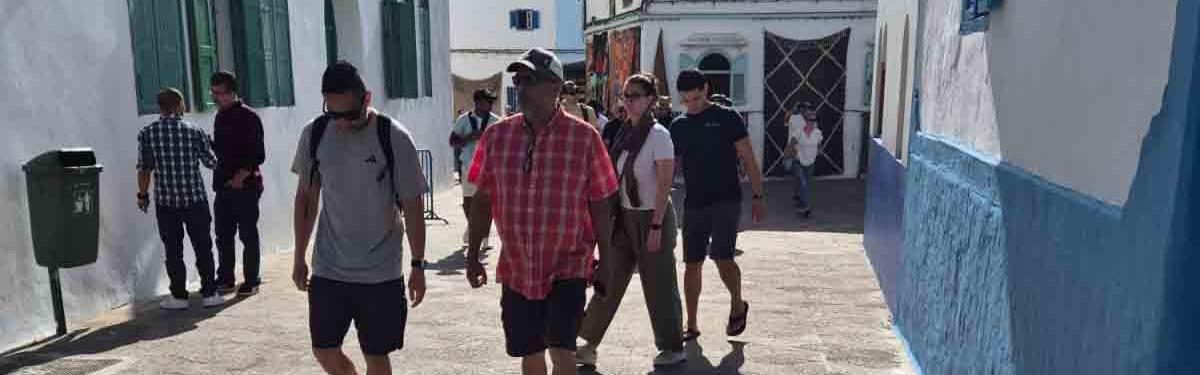 Tourists walking in the medina of the northern city of Assilah