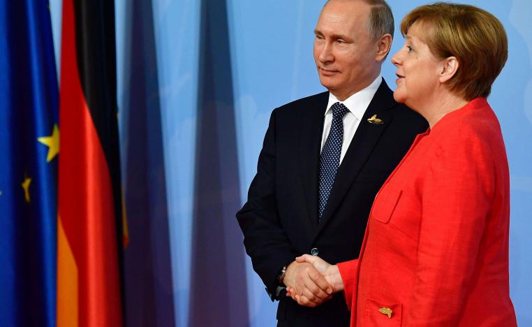 بوتين وميركل