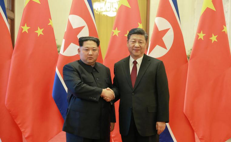 الرئيس الصيني شي جينبينغ وزعيم كوريا الشمالية كيم جونغ اون
