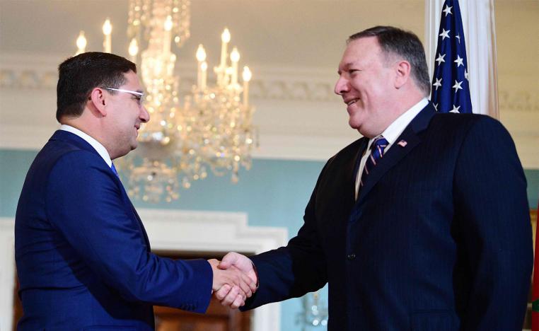Moroccan Foreign Minister Nasser Bourita (L) shakes hands with US Secretary of State Mike Pompeo at the US State Department in Washington