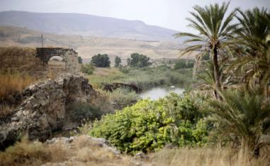 The Jordan river flows in the Jordan valley area called Baqura