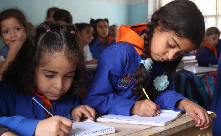 Syrian students attend classes at a school run by the Syrian government in the northeastern multi-ethnic city of Hassakeh on October 10, 2018. 