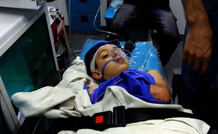 A wounded pupil lays on a stretcher at a hospital after a bus accident near the Dead Sea in Jordan 