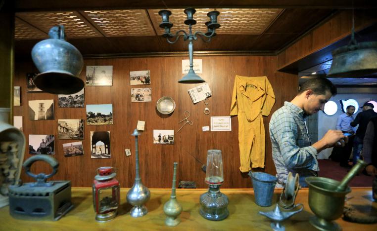 Items related to Islamic State militants are seen displayed on the wall of Qantara Culture Cafe in Mosul, Iraq October 26, 2018.