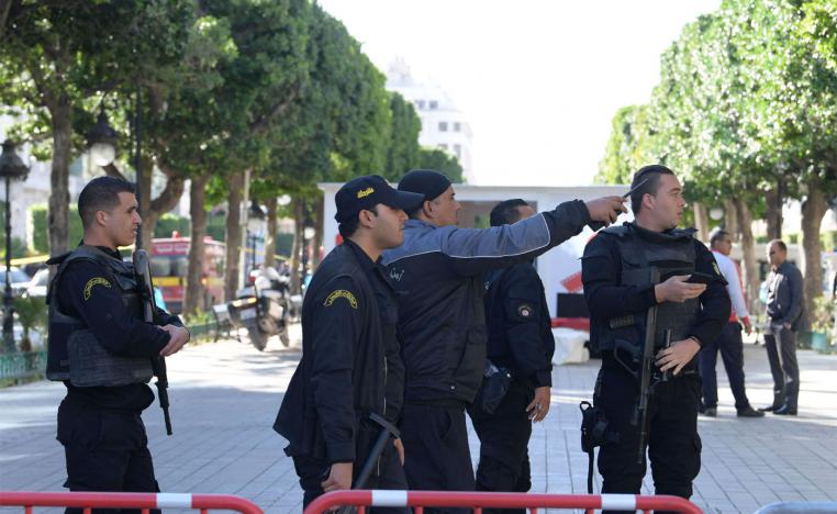 Tunisian police gathering at the site of a suicide attack in the centre of the Tunisian capital Tunis