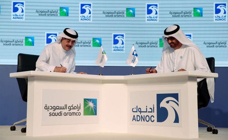 Saudi ARAMCO President and Chief Executive Amin H. Nasser (L) and Sultan Ahmed Al Jaber, UAE Minister of State and the Abu Dhabi National Oil Company (ADNOC Group) CEO