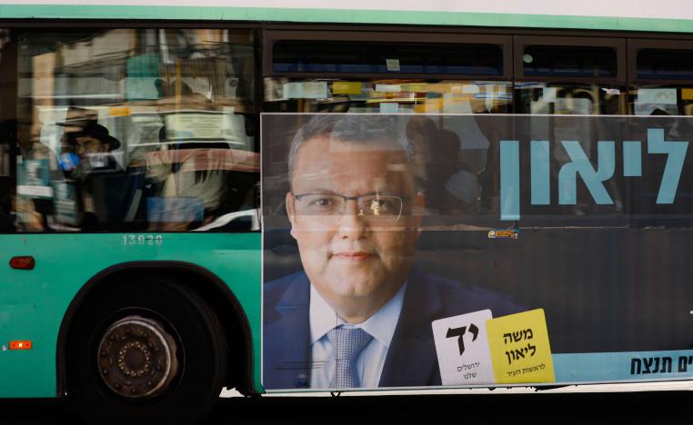 A campaign poster of municipal candidate Moshe Lion on a bus ahead of the upcoming Jerusalem municipal elections, in Jerusalem.
