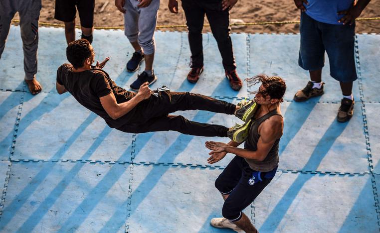 Members of the self-declared Egyptian Wrestling Federation (EWR) train in a ring during a session in the village of Serapeum