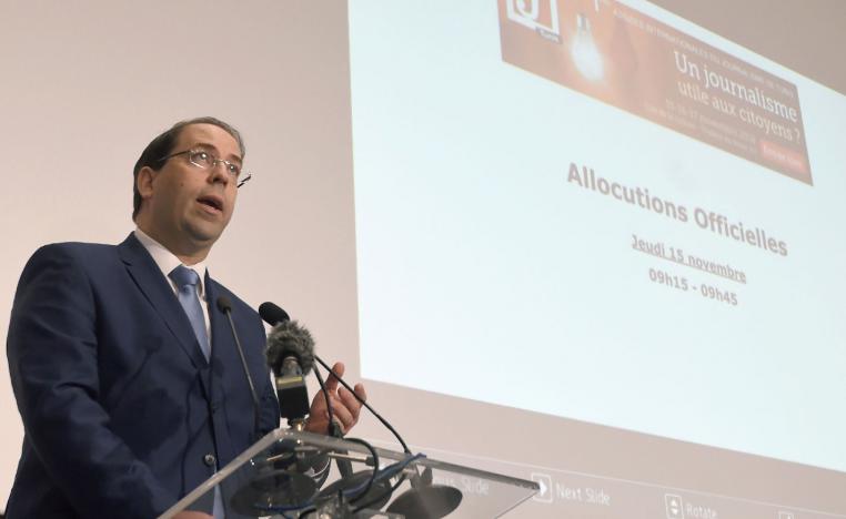Tunisian Prime Minister Youssef Chahed delivers a speech during the opening of the Assises Internationales du Journalisme in Tunis.
