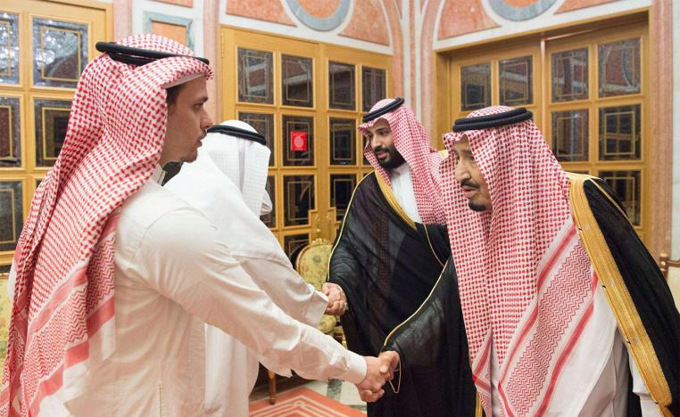 King Salman shakes hands with Khashoggi's son