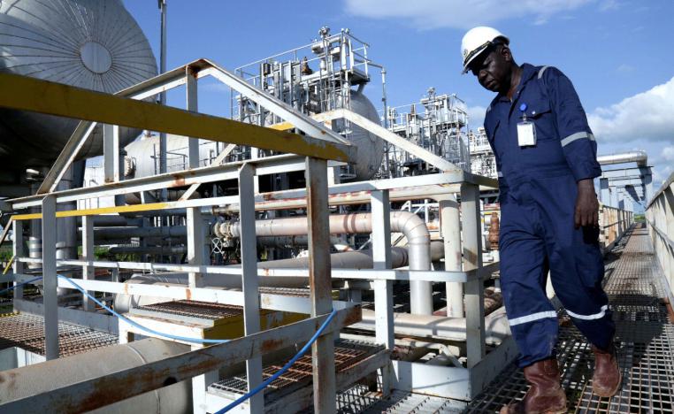 A worker walks by an oil well at the Toma South oil field to Heglig, in Ruweng State, South Sudan August 25, 2018.