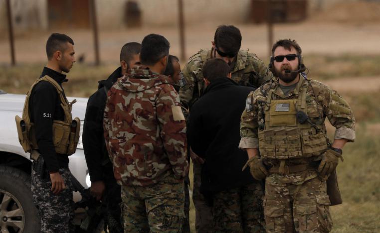 US forces and members of the Syrian Democratic Forces (SDF) patrol the Kurdish-held town of Al-Darbasiyah in northeastern Syria bordering Turkey on November 4, 2018. 