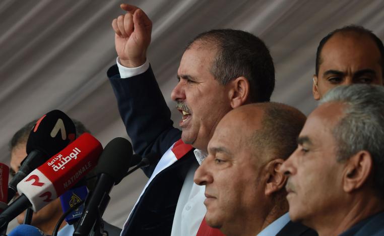 General Secretary of the Tunisian General Labour Union (UGTT) Noureddine Taboubi (C) gives a speech during a civil servants strike in the capital Tunis on November 22, 2018.
