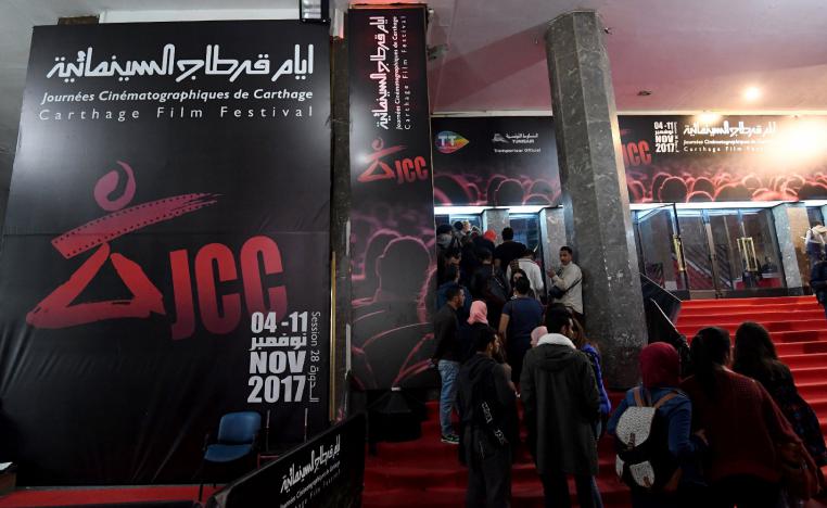 Tunisians standing in a queue outside a movie theatre in Tunis, during the 28th edition of the Carthage Film Festival on November 08, 2017.