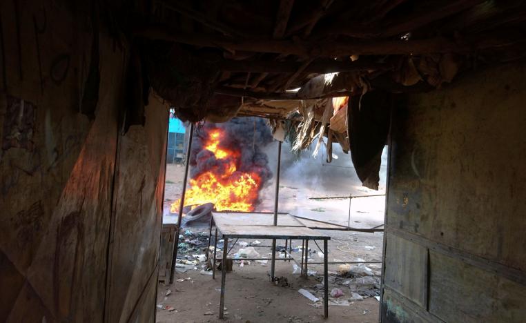 A bonfire is lit along the street during protests against price increases in Atbara, Nile River state in northeastern Sudan December 20, 2018.