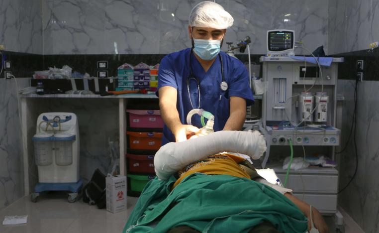 A Syrian doctor checks a child injured during a bombing after a surgery at a hospital in Syria's rebel-held Idlib province on September 10, 2018.
