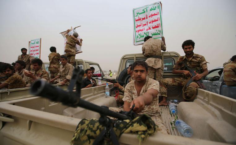 Houthi fighters ride on the back of trucks as they take part in a parade in the Red Sea port city of Hodeidah, Yemen August 24, 2017. 