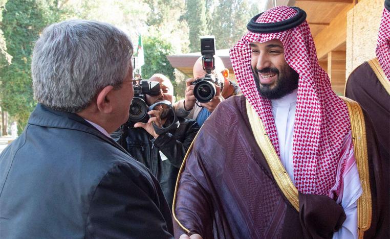 Saudi Arabia's Crown Prince Mohammed bin Salman Al Saud (R) shakes hands with Algerian PM Ahmed Ouyahia