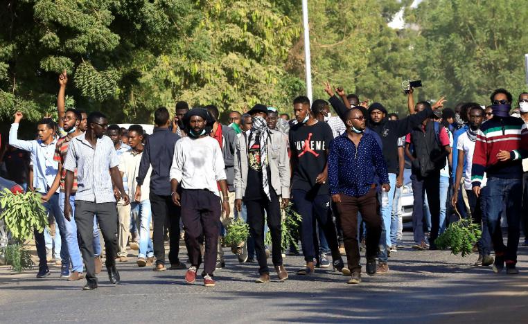 Sudanese demonstrators chant slogans as they march along the street during anti-government protests in Khartoum, Sudan December 25, 2018.