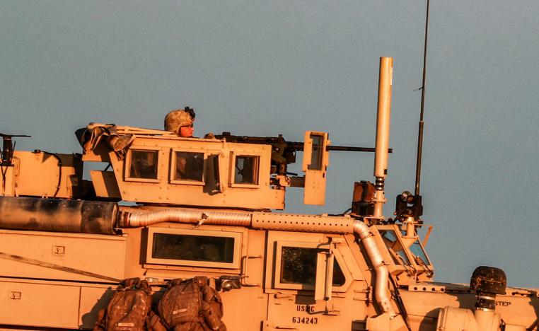 A US Marine Corps tactical vehicle is seen driving along a road near the town of Tal Baydar in the countryside of Syria's northeastern Hasakeh province on December 21, 2018.