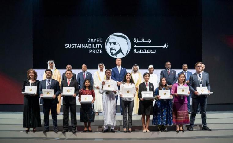 Abu Dhabi Crown Prince Sheikh Mohammed bin Zayed al-Nahyan (2nd row, 4th L) and UAE Vice-President Sheikh Mohamed bin Rashid Al Maktoum (2nd row, 6th L) pose with the winners of the Zayed Sustainability Prize for Energy.