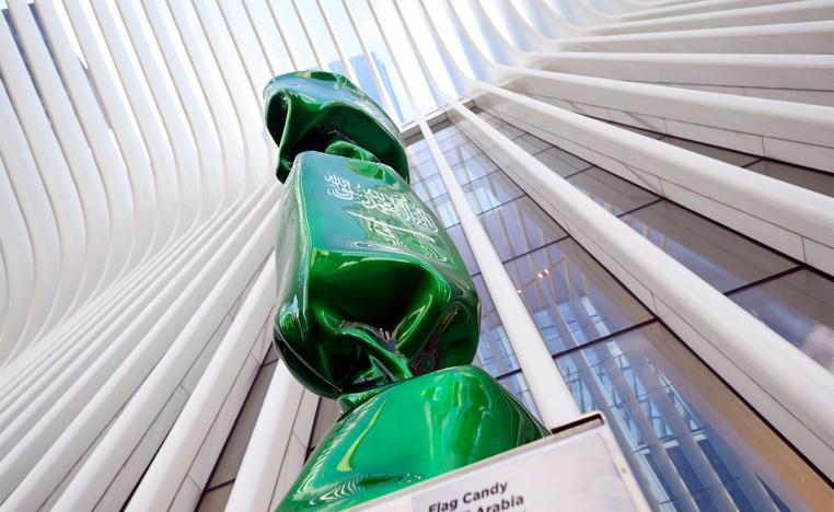 A sculpture with the flag of Saudi Arabia is part of an exhibit called 'Candy Nations' 