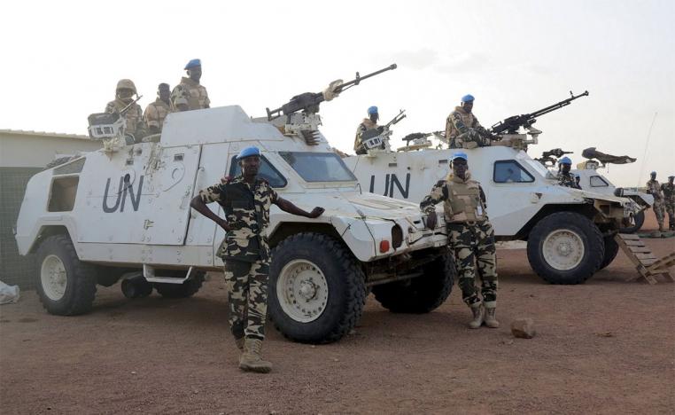 Chadian peacekeepers stand guard at the Minusma peacekeeping base in Kidal, Mali