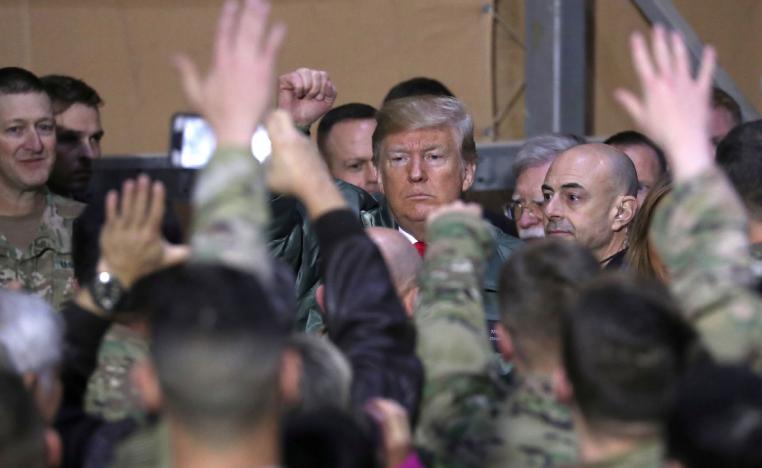 US President Donald Trump delivers remarks to U.S. troops on an unannounced visit to Al Asad Air Base, Iraq on December 26, 2018.
