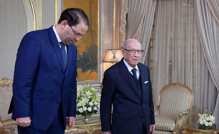 Tunisian President Beji Caid Essebsi (R) and Prime Minsiter Youssef Chahed