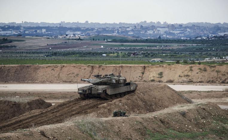 Israeli tank and soldiers take positions on the Israel Gaza border, Friday, Nov. 16, 2018.