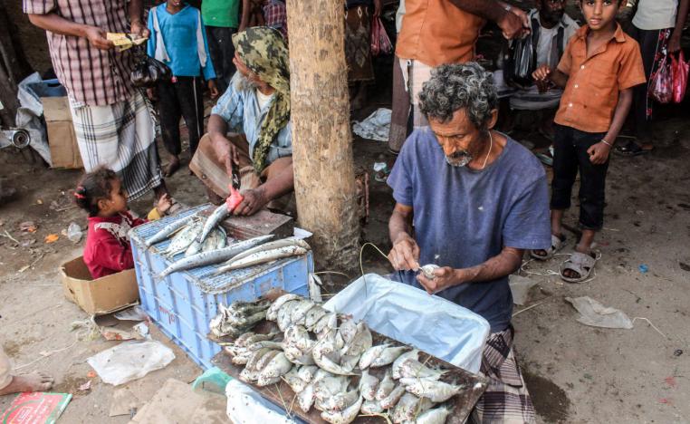 Yemeni fishermen clean and sell their catch at a market in the Khokha district of the western province of Hodeidah, on January 22, 2019.