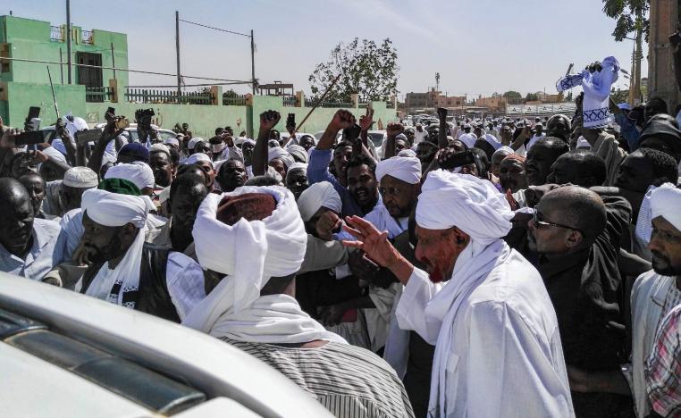 Sadiq al-Mahdi (2nd-R), Sudan's ex-prime minister and leader of the opposition Umma Party, is surrounded by supporters as he exits a mosque during a demonstration in the capital Khartoum's twin city of Omdurman on January 25, 2019.